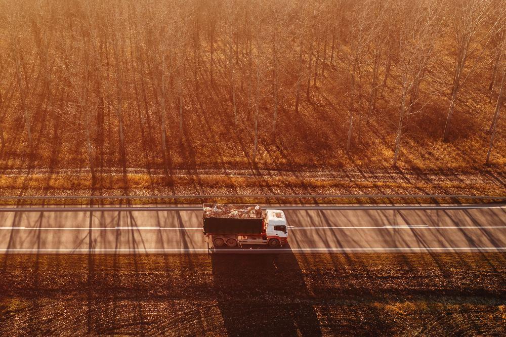 aerial view of truck with waste paper loaded in wa